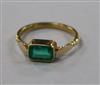 A late 1930's 18ct gold and collet set emerald ring, size K.                                                                           