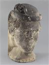 A medieval or later limestone head, height 14in.                                                                                       