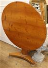 A Victorian circular pine tilt top table W.103cm                                                                                       