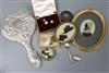 A silver-backed hand mirror, a Burmese pill box, silhouettes and sundries                                                              