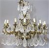 A gilt metal and cut glass fifteen light chandelier, width 36in.                                                                       