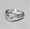 A modern 18ct white gold and diamond set wedding and engagement ring set, size M/N.                                                    