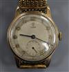 A gentleman's 1950's 9ct gold Tudor mid-size manual wind wrist watch, on associated flexible strap.                                    