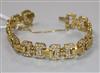 A yellow metal and diamond set fancy link bracelet, gross weight 41.4 grams.                                                           