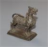 An Indonesian white metal model of a lion, height 55mm.                                                                                