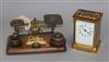 A brass carriage timepiece and a set of postal scales and weights                                                                      