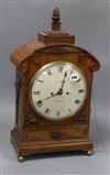 A Victorian carved mahogany mantel clock, F. Dorrington, Devonport, with double fusée repeating movement and painted Arabic dial Height