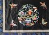 A Chinese embroidered black satin table frontal, late Qing dynasty, 211 x 56cm                                                         