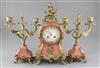 An early 20th century French pink marble clock garniture, 13.5in.                                                                      