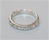 A palladium and nine stone diamond half eternity ring, size M.                                                                         