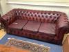 A Victorian style buttoned burgundy leather Chesterfield settee, width 206cm depth 88cm height 70cm                                                                                                                         