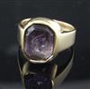 A late Victorian 15ct gold and octagonal amethyst intaglio ring, carved with the bust of a black man to sinister, size Q.              