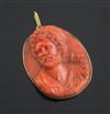 An antique Italian gold mounted oval coral cameo pendant, carved with the bust of a bearded archer, 41mm.                              