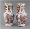 A pair of Chinese famille rose 'Mandarin' hexagonal baluster vases, Qianlong period, height 27.5cm, slight damage                      