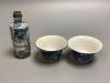 Two 19th century blue and white Chinese tea bowls and a 19th century snuff bottle, 9cm.                                                                                                                                     