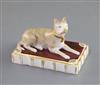 A Rockingham porcelain figure of a recumbent terrier, c.1830, L. 9.7cm                                                                 