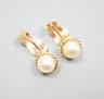 A pair of 9c and cultured pearl ear clips, 17mm, gross weight 3.1 grams.                                                                                                                                                    