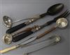 A pair of white metal mounted salad servers, two silver tea strainers, a pair of sugar tongs, a cream ladle & a butter knife (7)       