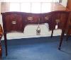 A George III and later mahogany serpentine fronted sideboard, 114.5 cm long, 61 cm deep, 87.5 cm high                                                                                                                       