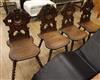 Four carved oak hall chairs                                                                                                            