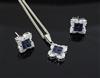 A sapphire and diamond square-set pendant on 18ct white gold fine chain and a pair of earrings en suite, pendant 11.mm.                