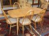 An Ercol dining table and chairs, and a sideboard 150cm, 155cm                                                                         