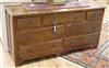 A reproduction oak seven drawer dresser base W.152cm                                                                                   