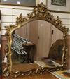 A rococo gilt wall mirror W.120cm                                                                                                      