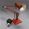 A 1960's orange anglepoise lamp                                                                                                        