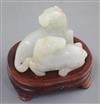 A Chinese pale celadon and russet jade group of two horses, length 6cm                                                                 