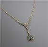 An Edwardian style yellow metal, blue topaz, diamond and seed pearl set drop pendant necklace, pendant 5cm.                            