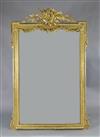 A late 19th French giltwood and gesso wall mirror, W.4ft 8in. H.6ft 3in                                                                