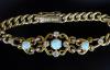 An early 20th century 15ct gold white opal and diamond set curblink bracelet                                                                                                                                                