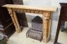 A George III style limewood chimneypiece, in the Strawberry Hill Gothic style, width 150cm, height 111cm together with a cast iron fireback and fire basket (3)                                                             