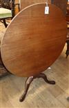 A George III circular mahogany tilt top tea table Diameter 92cm                                                                        