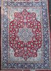 A Kirman red ground carpet, 12ft 1in by 8ft 10in.                                                                                      