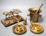 A quantity of bronze and brass wares including a pestle and mortar, candlesticks, coffee grinder etc, tallest items, candlesticks 48 cms high.                                                                              