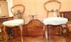 A pair of Victorian rosewood balloon back dining chairs                                                                                