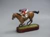 A Cameron Sculptures cold-painted bronze model of a racehorse with jockey up, height 16.5cm                                                                                                                                 