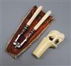 An ivory elephant cane top and a pair of ivory handled nutcrackers                                                                     