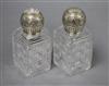 A pair of late Victorian silver mounted rectangular cut glass scent bottles, John Newton Mappin, London, 1891, 15.2cm.                 