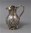 A Victorian Scottish silver milk jug, James Crichton & Co, Edinburgh, 1885, 12.3cm.                                                    