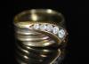 A George V 18ct gold and graduated five stone diamond set coiled serpent ring                                                                                                                                               