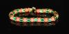 A good 1950's Cartier gold, coral bead and green enamel set articulated bracelet                                                                                                                                            