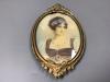 A portrait miniature of a lady, in a brass frame                                                                                                                                                                            