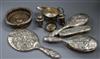 Three silver condiments, a silver sauceboat, silver brushes(a.f.) and a plated coaster.                                                