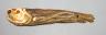 A Japanese ivory 'dried fish' netsuke, 19th century, 10cm long                                                                                                                                                              