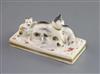 A Rockingham porcelain group of a cat and three kittens, c.1826-30, L. 10.8cm                                                          