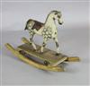 A rare Victorian carved and painted wood dapple grey rocking horse, W.31in. H.22in.                                                    