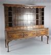 A George III oak dresser, W.6ft 4in. D.1ft 8in. H.5ft 9in.                                                                             